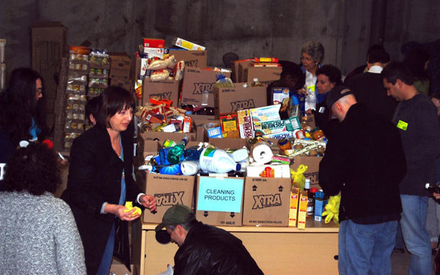 Volunteers shopped for stacks of groceries and then deposited them in the basement at the JFS headquarters in Elizabeth.