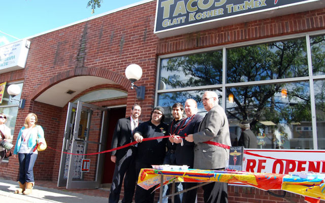 At the opening of the Elizabeth’s new kosher taco restaurant, Mayor Chris Bollwage cuts the ribbon, accompanied by, from left, Rabbi Joshua Hess, owners Eli Barashi and Josh Weiss, and Gordon Haas. Photos by Elaine Durbach