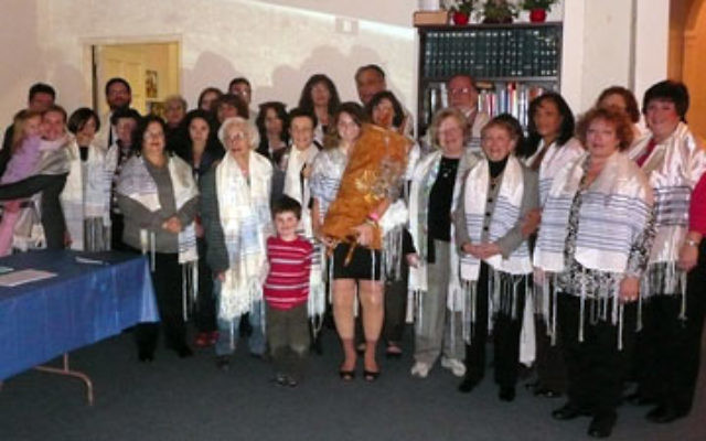 Women as well as men wore tallitot at the Shabbat service at Temple Sholom on Dec. 18, to show solidarity with the Jerusalem group Women of the Wall.