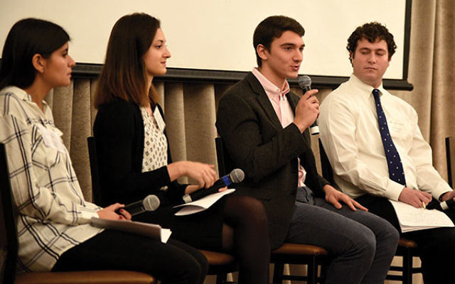 Gabriel Goldstein speaks during a panel on college student experiences. 