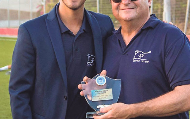 Ivan Cohen of Westfield displays his Israel Premier Lacrosse League Coach of the Year Award with IPLL commissioner Ted Bergman.
