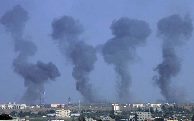 Black smoke rises following an Israeli airstrike on the Gaza International Airport in Rafah, July 7, 2014. (Abed Rahim Khatib/Flash 90)
