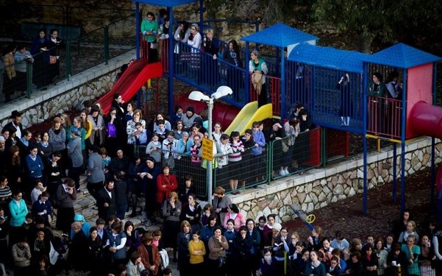 Hundreds of Israelis mourning at the funeral of three of the victims killed in the synagogue terror attack on the Bnei Torah Kehilat Yaakov synagogue in western Jerusalem, Nov. 18, 2014. (Miriam Alster/Flash90)