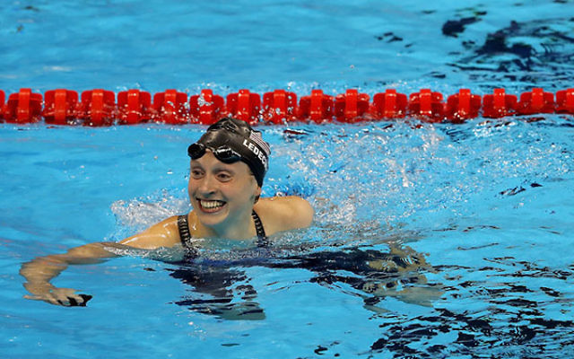 Katie Ledecky celebrating winning gold and setting a new world record in the Women’s 400-meter freestyle final on day two of the Rio 2016 Olympic Games at the Olympic Aquatics Stadium, Aug. 7, 2016. (Al Bello/Getty Images)