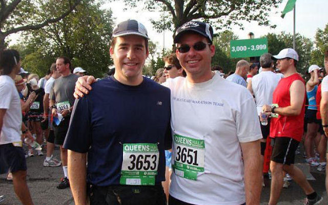 Stephen Weiss, left — with his brother Dan at the Queens half-marathon last July — said that helping Holocaust survivors “is an important issue in our family.” Photo courtesy Stephen Weiss