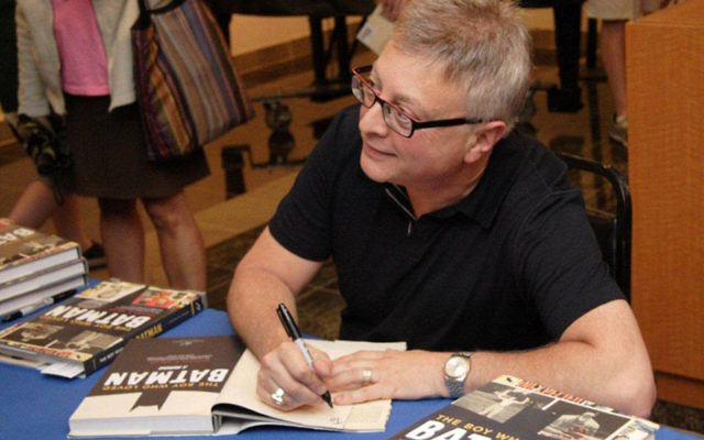 Michael Uslan, producer of six Batman blockbusters, greets friends from his younger days at the Axelrod Performing Arts Center.