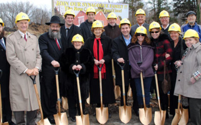 Dignitaries and community leaders — including Monmouth County Freeholder Barbara McMorrow, front row, center — wield golden shovels at the Nov. 27 ground breaking for Congregation Sons of Israel in Wayside.