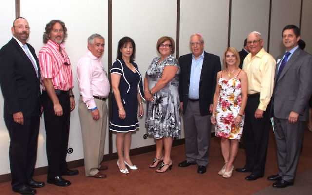 At the Monmouth federation annual meeting are newly installed officers, including, from left, president Stuart Abraham; outreach vice president Todd Katz, board member Joel Krinsky, board chair Elise Feldman, Women’s Philanthropy president Sheryl