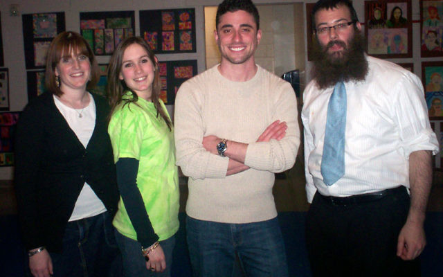 With Marc Elliot, second from right, are, from left, Friendship Circle director Chana’le Wolosow, FC volunteer coordinator Moushkie Chazanow, and Rabbi Levi Wolosow of the Chabad of Western Monmouth County.