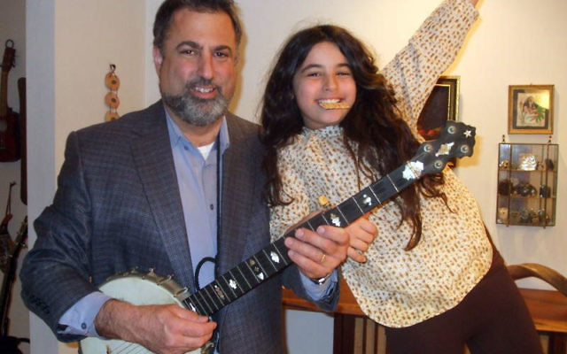 Rabbi Moshe Rudin, student rabbi at Temple Hatikvah in Flanders for the last four years, was ordained by the Academy for Jewish Religion on May 13. He is pictured here with his daughter, Sophie. Photo courtesy Rabbi Moshe Rudin