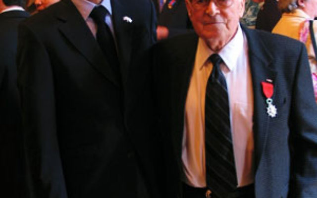 World War II veteran Samuel Brummer, right, after receiving his Legion of Honor of the French Republic medal from French Consul General Philippe Lalliot.