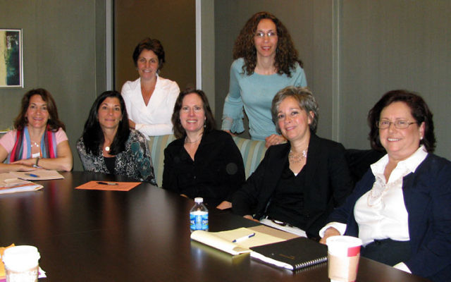 At the April 27 meeting of synagogue leaders and JFS social workers are, from left, standing, Beth Sandweiss and Lisa Sturm, and, seated, Wendy Sabin, Beth Berns, Ilana Mazur, Ann Hicks, and Judie Gerstein. Photo by Robert Wiener