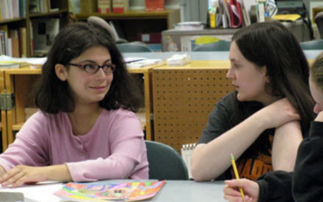 Hannah Herbert, left, a student at the JTEENMW Learning Community, works with her shadow, Ellie Sandman.