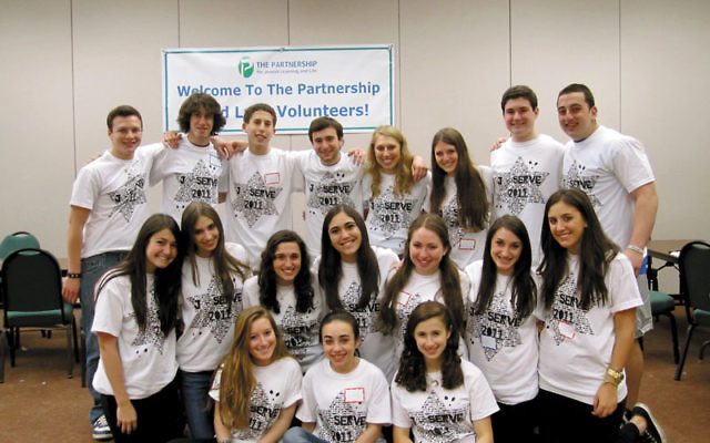 The J-Serve teen committee celebrates their day of service.