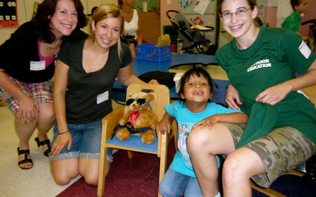 Members of the Steindler family, from left, Kelly and her daughters, Jessica and Romana, with Sandy at Cerebral Palsy of North Jersey’s Horizon School on Aug. 9.