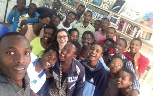 Naomi Stanway with members of the students she advised in a youth village in Rwanda.