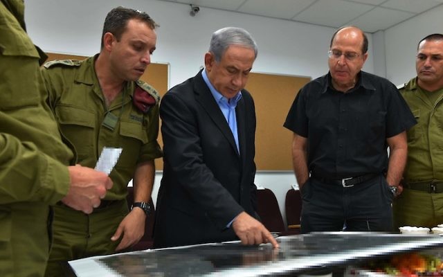 Israeli Prime Minister Benjamin Netanyahu and Defense Minister Moshe Yaalon being briefed in the South Front Command on Operation Protective Edge, July 9, 2014. (Ariel Hermoni/Ministry of Defense/Flash90)