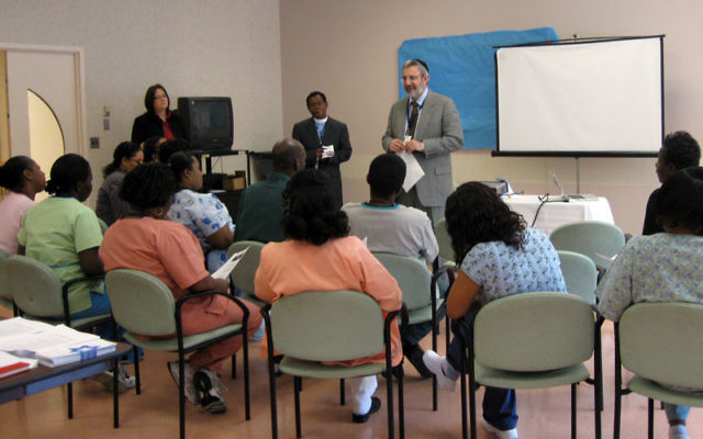 Rabbi Zvi Karpel, chaplain at Daughters of Israel in West Orange, leads a healing session April 14 at the facility for seniors with the Rev. Noster Montas and the Rev. Julie Taylor.