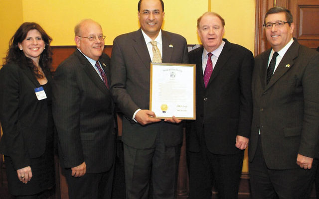 Israeli Consul General Ido Aharoni, center, displays his proclamation with, from left, Melanie Roth Gorelick, associate director, MetroWest Community Relations Committee; Roger Jacobs, vice president, NJ State Association of Jewish Federations; State Sen.