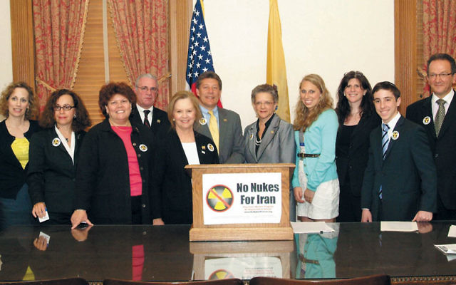 Jewish leaders gathered May 9 with legislators after the NJ State Assembly passed a resolution urging stiffer sanctions against companies doing business with Iran. At the Statehouse in Trenton are, from left, Nancy Kislin Flaum, No Nukes for Iran; Beth Ha
