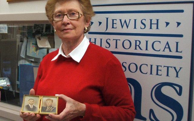 Ann Bernstein, holding photographs she donated to the Jewish Historical Society of MetroWest, uncovered a cache of letters written by a relative caught up in the Holocaust.