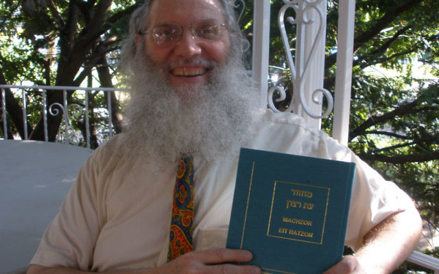 Rutgers professor Joseph Rosenstein with his Machzor Eit Ratzon, the High Holy Days prayer book he published in July. Photo by Debra Rubin