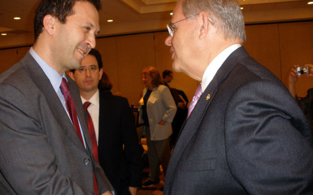 U.S. Sen. Robert Menendez, right, greets Shlomi Kofman, deputy consul general for Israel in New York, during the May 15 Hadassah conference in Monroe. Photo by Debra Rubin