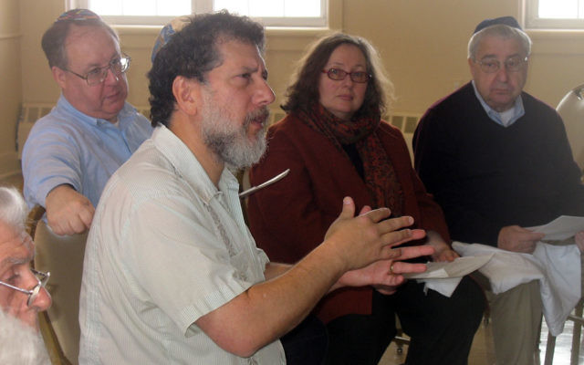 David Zinner, front, executive director of Kavod v’Nichum, offers a training session on tahara to about 25 people from Morristown Jewish Center-Beit Yisrael, including, from left, Ira Hammer, Barbara Kavadias, and Phil Frost. MJCBY is formi