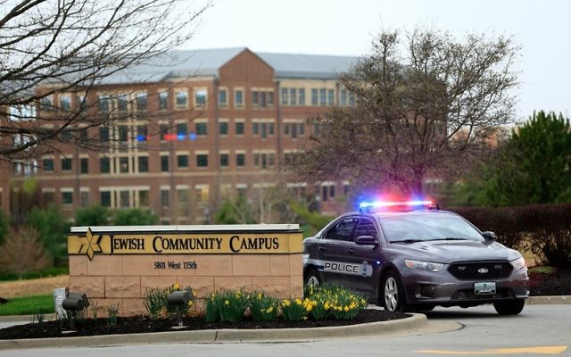 A police car is seen at the entrance of the Jewish Community Campus in Overland Park, Kan., after deadly shootings there and at a nearby assisted-living facility, April 13, 2014. (Jamie Squire/Getty Images)