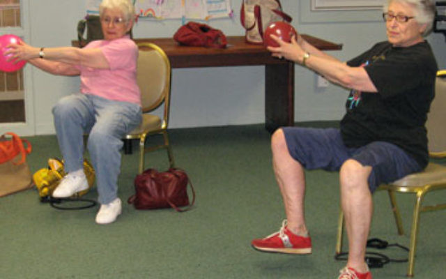 Seniors take part in a strength-training session, part of an exercise program for Secure@Home members held at The Jewish Center in Princeton.