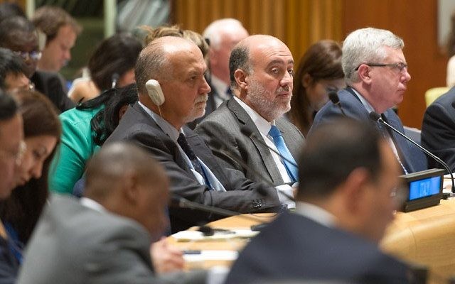 Ambassador Ron Prosor, center, without headphones, speaks at the U.N. General Assembly. UN Photo by Mark Garten