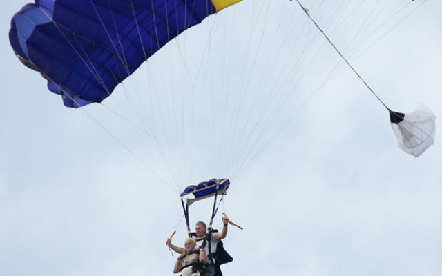 Aaron Rosloff — front, with an instructor — went skydiving on July 3 to celebrate his 90th birthday and raise money for the Food Pantry of South Brunswick. Photo by Ben Gottesman