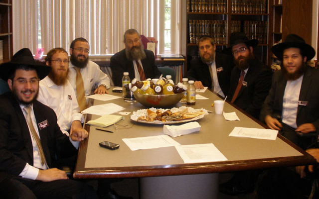 Rabbis gather at Chabad House at Rutgers University in New Brunswick for the July 12 inaugural meeting of a statewide organization for Chabad chaplains. Photo by Debra Rubin