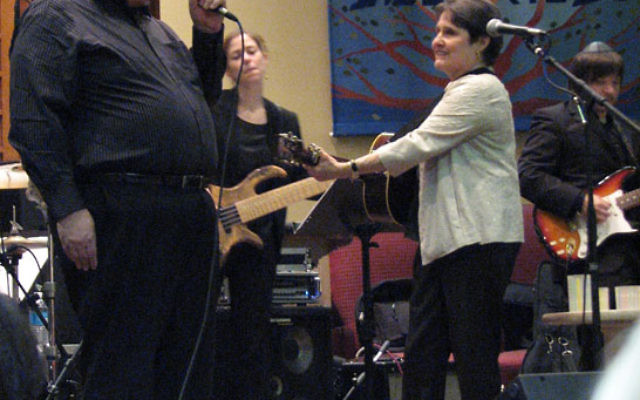 Debbie Friedman is joined by Cantor Bruce Rockman at a concert at Congregation B’nai Tikvah in North Brunswick in 2009. Photo by Bobbi Binder