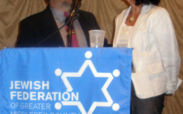 New federation president Arlene Frumkin is congratulated by her rabbi, Robert Wolkoff, of Congregation B’nai Tikvah. Photos by Debra Rubin