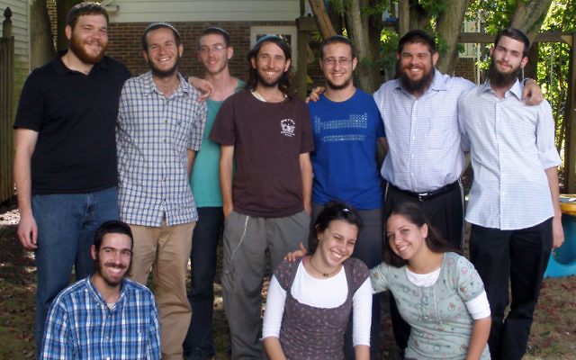 The Steinsaltz Ambassadors gather Aug. 27 in the Highland Park backyard of program director Rabbi Shmuel Greene, standing, second from right, before being sent to do service in Jewish institutions in New Jersey, Washington, and Arizona. Binyamin Zuckerm