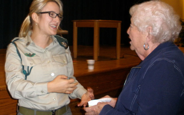 Miri Levy — one of the first three women to go undercover as part of the Israeli border police — greets a community member after her Sept. 26 talk at Temple B’nai Shalom in East Brunswick.
