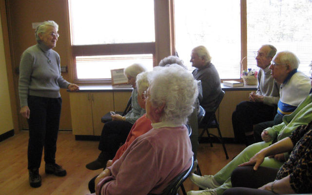 Volunteer Bobby Garfinkel of Colonia works with participants of the Elderday at Edison program for people with Alzheimer’s and cognitive disorders. Photo courtesy Jewish Family and Vocational Service of Middlesex County