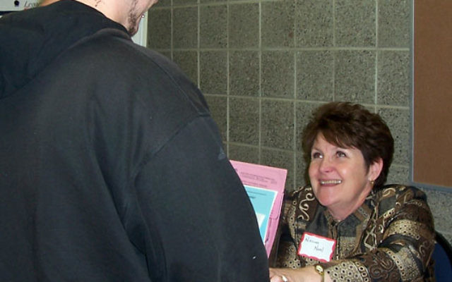 Noreen Noel, director of the women’s center at the Jewish Family and Vocational Service of Middlesex County, talks to a youth aging out of the foster care system during a career development information fair and seminar. Photo courtesy JFVS of Midd