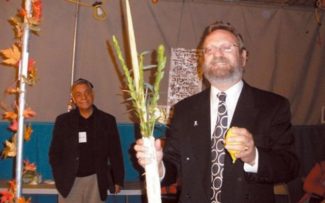 Rabbi Robert Wolkoff — shown at an interfaith Sukkot celebration last October at Congregation B’nai Tikvah — said Jews should be ready to fight “for the right of our neighbors to observe their holidays.” Photo by Debra Rubi