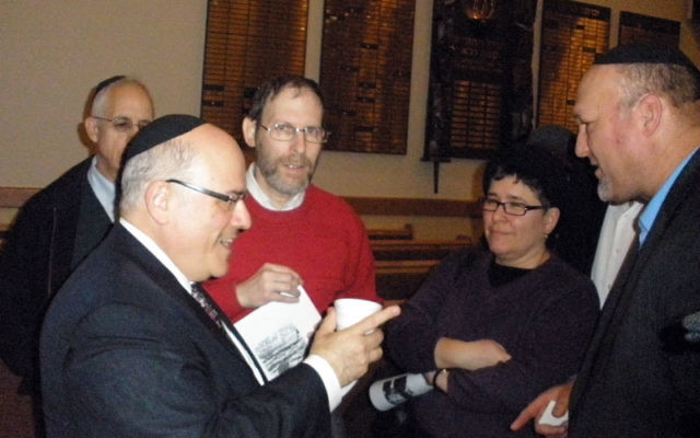 Rabbi Dr. Jacob J. Schacter continues the conversation after his talk about interfaith relations with Muslims and Christians as part of the Orthodox Forum of Edison/Highland Park. Photo by Debra Rubin