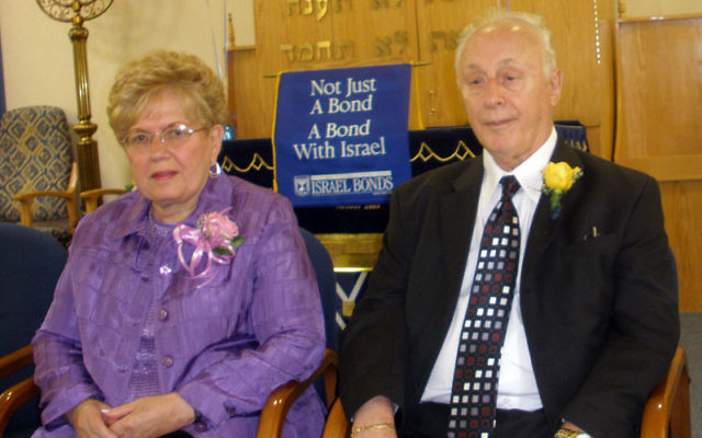 Jack Chevlin of Monroe, a former music teacher at Roselle Park High School, had his life saved by a partisan who led his family and 200 other Jews to safety. He is shown with his wife, Ethel, at an Israel Bonds luncheon at the Jewish Congregation of Con