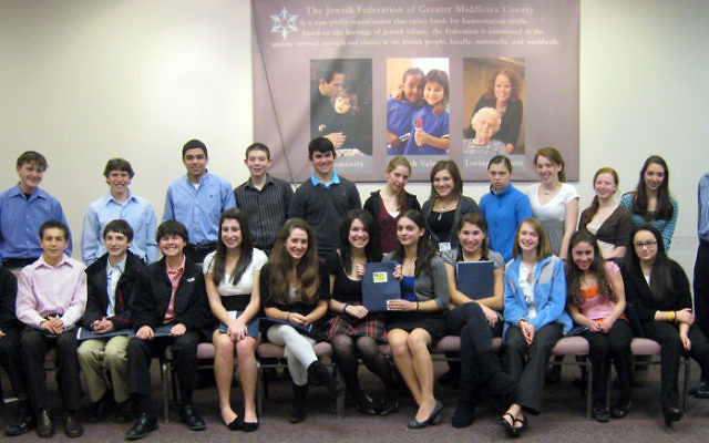 Teen philanthropists on the J. Team of the Jewish Federation of Greater Middlesex County gather at the federation’s South River office. The teens awarded $7,000 to four charitable organizations after months of presentations and research. Photo cou