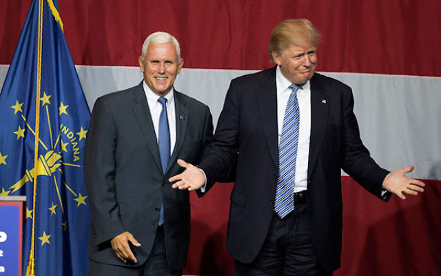 Donald Trump and Indiana Governor Mike Pence onstage during a campaign rally at Grant Park Event Center in Westfield, Indiana, July 12, 2016.