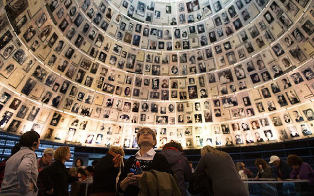Illustrative photo: Visitors gather in the Hall of Names at Yad Vashem in Jerusalem on Jan. 27, 2014, International Holocaust Remembrance Day. Getty Images