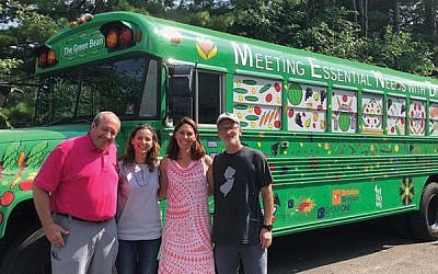 From left, MEND board chair Jamie Anthony, MEND executive director Robin Peacock, and run organizers Jessica Lituchy and Tim Lyons with “The Green Bean.” Photo courtesy Jessica Lituchy