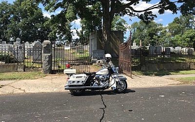 A police motorcycle outside the B’nai Abraham Cemetery in Newark, N.J. (Dov Ben-Shimon/Facebook)