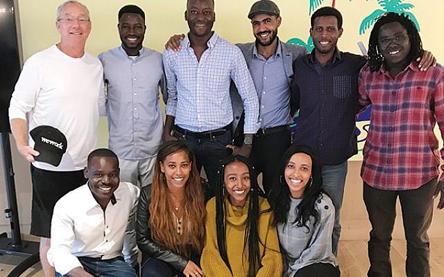 Joey Low (top row, at left), founder of Israel At Heart, with Ethiopian Jews and African asylum seekers on a trip to New York he sponsored this month. Photo Courtesy Joey Low