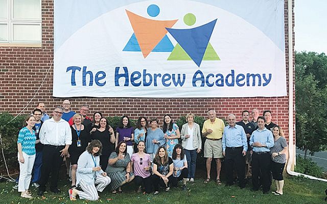 Board members, supporters, and staff celebrate the new name — The Hebrew Academy — of what was the Solomon Schechter Day School of Greater Monmouth County. Photo courtesy The Hebrew Academy