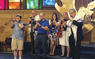 Members of the shofar-blowing team include, from left, Paul Nadler, Marc Rappaport, Charles Silerman, Anastasia Rappaport, Sandy Wilson, and Alan Grossman. Not pictured are Barak Malkin, Rose Lamorte, and Rick Simon. Photo courtesy Sandy Gonzalez Wilson